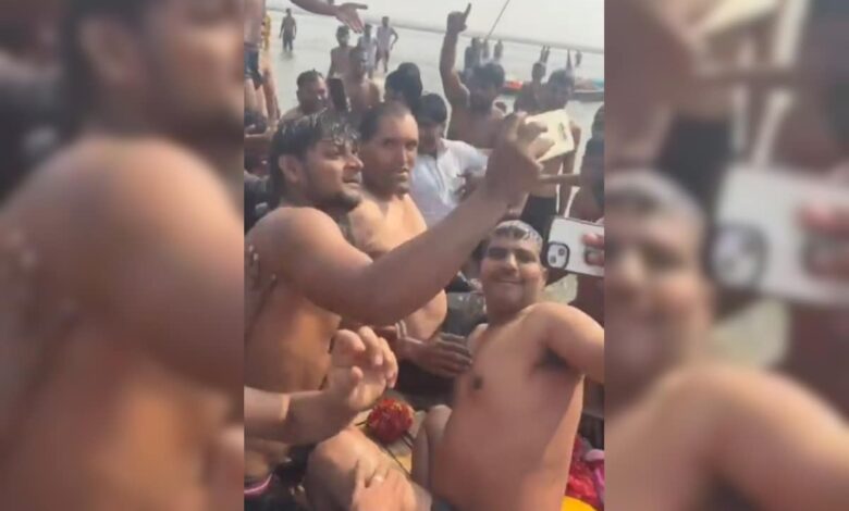 The great khali takes holy dip at maha kumbh. Devotees, Security Officials Start Selfie War. Watch